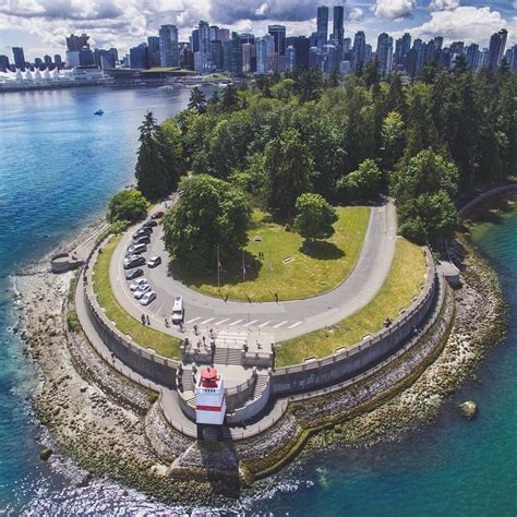 Spectacular Drone Shot Of Stanley Park With Downtown Vancouver In The