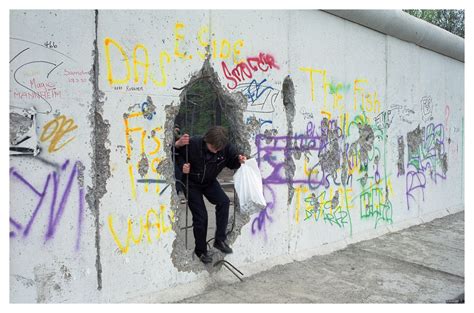 Explores a lot of music, books and applications with high download speed. A hole in The Wall | A kid stepping from East to West Berlin… | Flickr