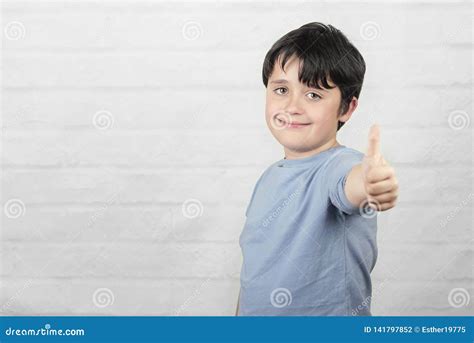 Smiling Child Showing Thumbs Up Stock Photo Image Of Motivation