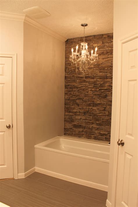 My Tub With Faux Stone Wall Accent Wall And Chandelier House