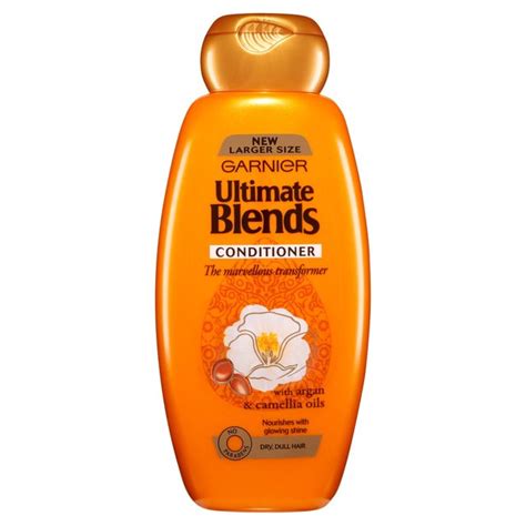 Transform with up to 48 hours of glowing shine. Garnier Ultimate Blends Argan Oil Shiny Hair Conditioner ...