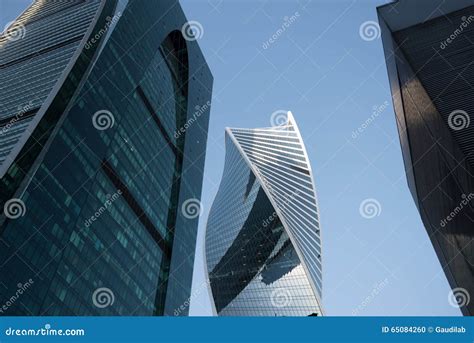 View From Below Of Contemporary Tall Skyscrapers Against Blue Sky