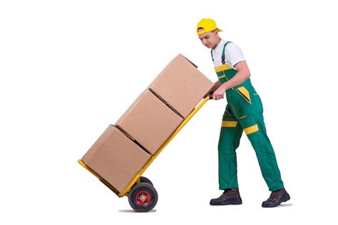 Premium Photo Young Man Moving Boxes With Cart Isolated On White
