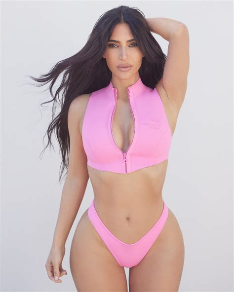 kim kardashian stuns in skims zip up bikini top showcasing her curves in a sizzling photo