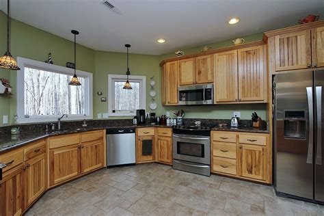 The finish on your kitchen cabinets plays a role in the choice of wall paint colors. Beautiful kitchen | Hickory kitchen cabinets, Kitchen ...