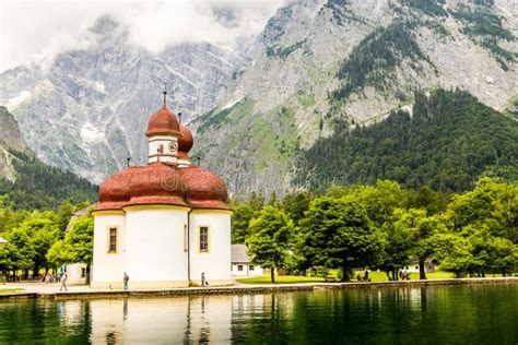 Konigsee Lake With St Bartholomew Church Surrounded By Mountains