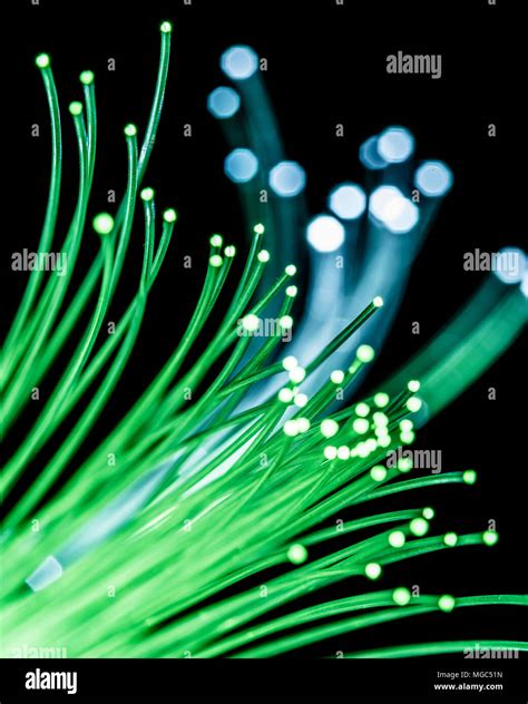 Bundle Of Optical Fibers With Green Light Black Background Stock Photo