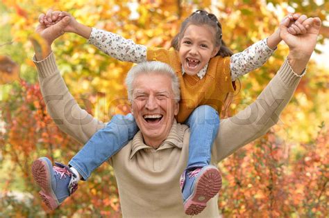 Grandfather And Granddaughter In Park Stock Image Colourbox
