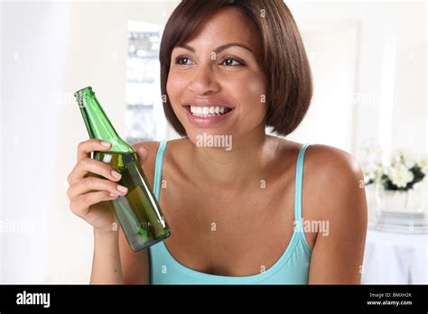 Woman Holding Bottle Of Beer Stock Photo Alamy