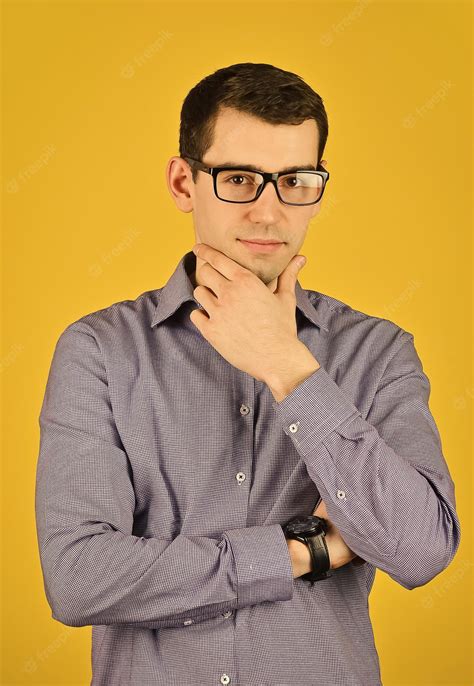 Premium Photo Handsome Man Wearing Glasses Touch Chin Friendly Face Portrait Of An Unshaven