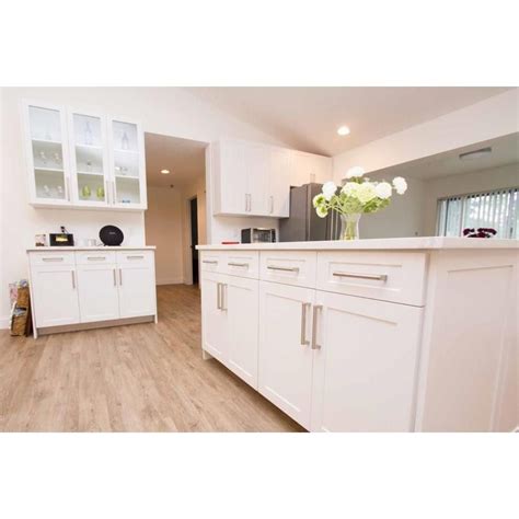 With a modern white painted finish, the white shaker cabinets will brighten your kitchen and add plenty of light. Surfaces Bennett 11-in x 15-in White Engineered Wood ...