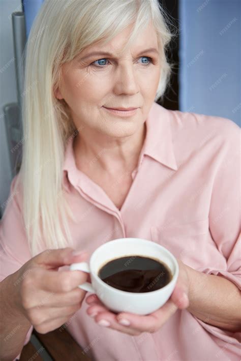 Free Photo Close Up On Mature Woman Enjoying Good Coffee On The Balcony