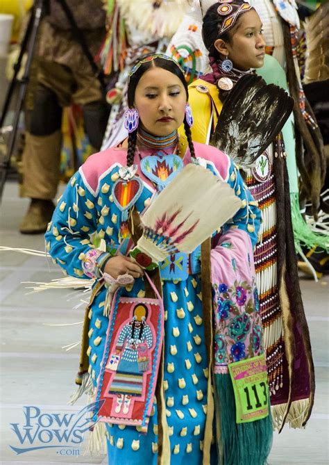 Several People Dressed In Native American Clothing And Headdress