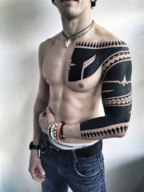 Chest and shoulder maori tattoo design. 50 Tribal Chest Tattoos For Men - Masculine Design Ideas