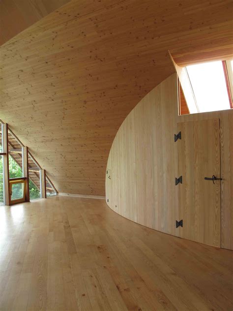 Curved wall, made with ash, meets curved ceiling, made with douglas fir