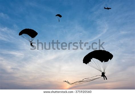 Silhouette Parachute Airplane On Sunset Background Stock Photo Edit