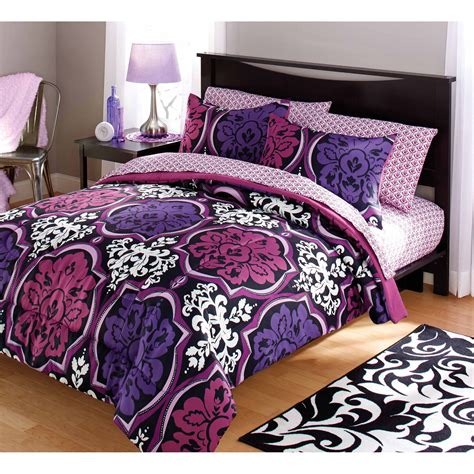 This set includes a comforter and two shams (the twin size includes one sham) and you have your choice of seven neutral colors such as pewter gray, navy, and ivory. Your Zone Dotted Damask Comforter Set - Walmart.com