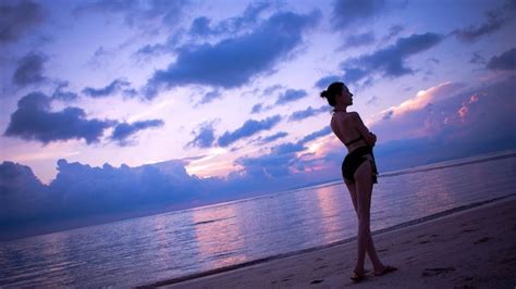 premium photo sexy bikini girl on the beach by the sea wallpaper