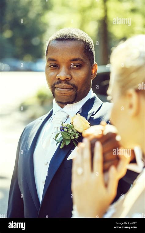 Handsome African American Groom Looks At Adorable Bride Stock Photo Alamy