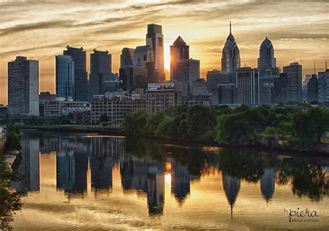Great Shot Of The Philadelphia Skyline And Its Reflections At Sunrise