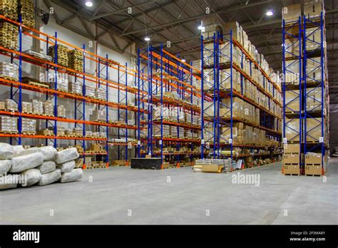 Interior Of A Modern Warehouse Storage Of Retail Shop With Pallet Truck