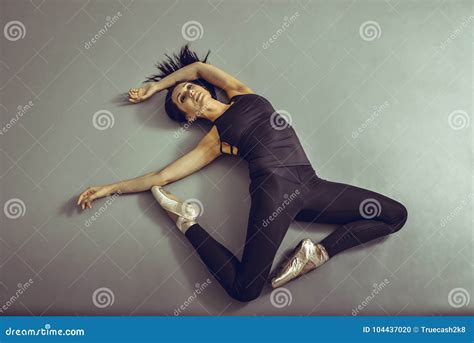 Young Woman Ballerina Lying On The Floor Without Feelings At Ballet