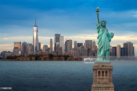 The Statue Of Liberty With Downtown New York Skyline Panorama With