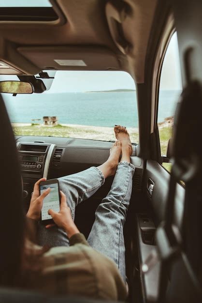 Premium Photo Woman Sitting In Car Using Her Phone Summer Sea Beach