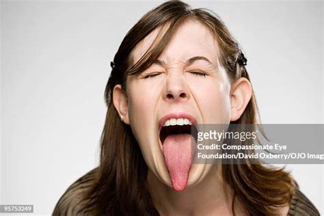 people with long tongues photos and premium high res pictures getty images