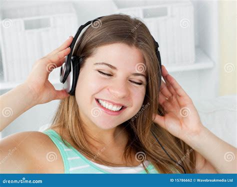 Cheerful Woman Listening To Music With Headphones Stock Photo Image