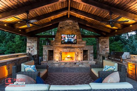 A Pavilion With An Outdoor Kitchen Fireplace And An Entertainment System Outdoor Covered