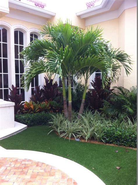 Tropical Colors And Textures At Entry Accented With Synthetic Turf