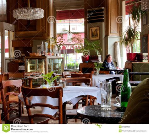 Design an outdoor café with lamp decorations. Viennese Style Interior Design And People Inside Editorial ...