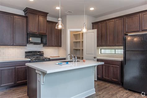 Gallery featuring rustic kitchen cabinets including finishes, door styles, hardware, color rustic kitchen cabinets are well known for their rugged aesthetics, natural appearance and strong character. Woodgate Townhomes Apartments - Conroe, TX | Apartments.com