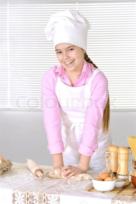 Cute Girl Baking Cake In The Kitchen At Stock Image Colourbox