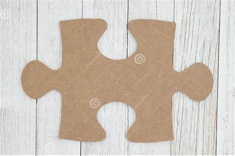 cardboard puzzle piece on weathered whitewash textured wood background stock image image of