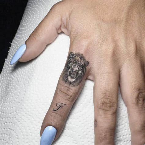 Reveal Your Fearless Nature With A Lion Finger Tattoo
