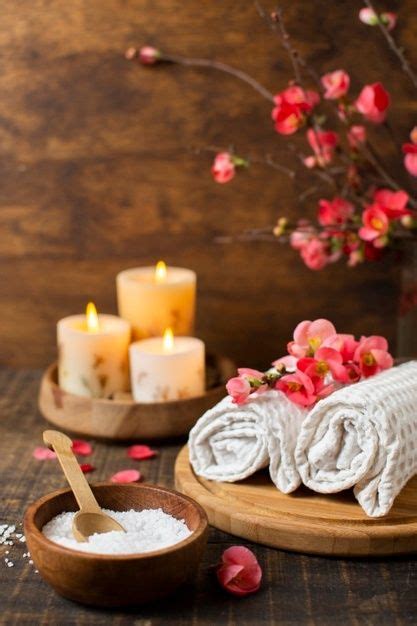spa arrangement with lit candles and towels spa decor spa images spa massage