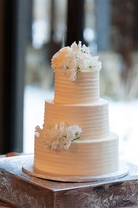 White Lisianthus Topped Textured White Buttercream Wedding Cake
