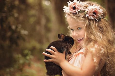 Little Girl Holding A Bunny Hd Wallpaper Background Image 2048x1368