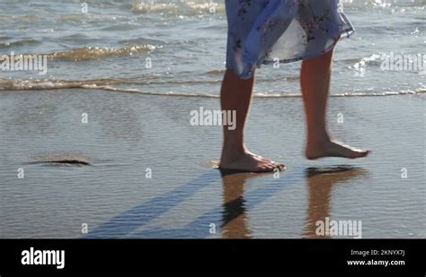 Female Feet Walking On Sandy Beach Leaving Footprints Barefoot Woman