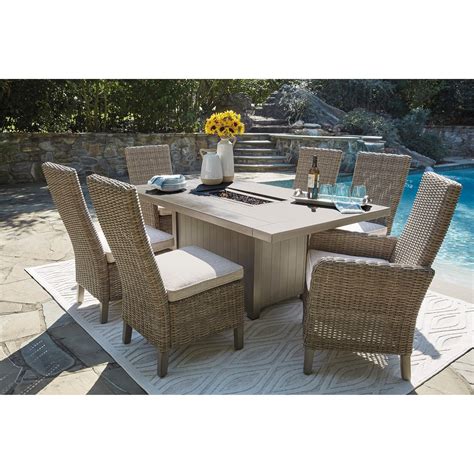Fire table is your perfect companion for backyard entertaining. Signature Design by Ashley Windon Barn 7-Piece Rectangular ...