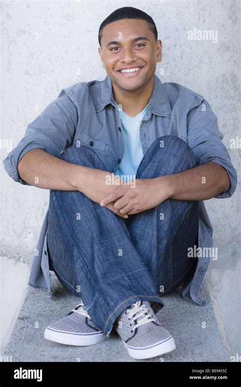 Young Man Sitting Stock Photo Alamy