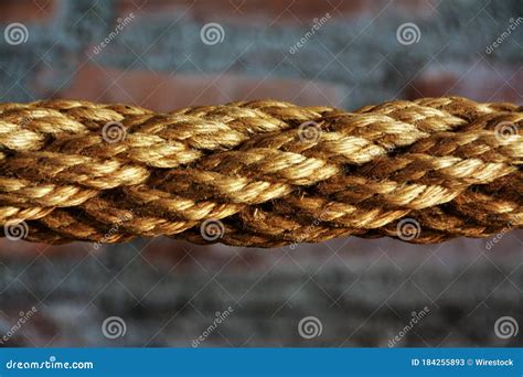 Closeup Shot Of A Brown Multilayered Rope With A Blurred Background