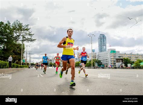 Group Runners Athletes Running Streets Of City In Europe Asia Marathon