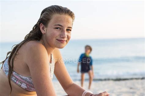 Smiling Teenage Girl At Sandy Tropical Beach Grand Cayman Island