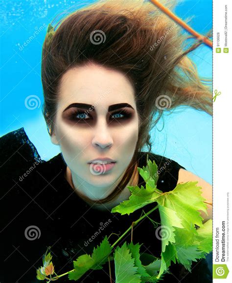 Underwater Fashion Portrait Of Beautiful Blonde Young Woman Stock Photo