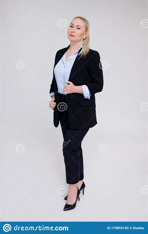 Full Length Portrait Of Beautiful Plus Size Woman In Black Business
