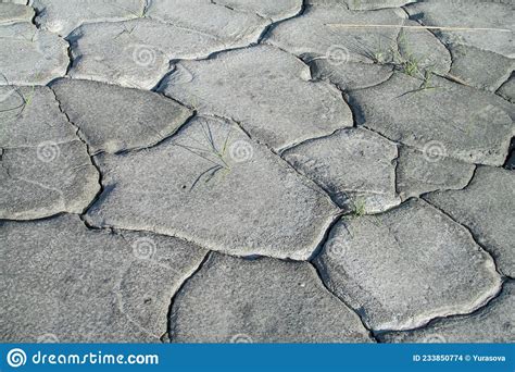 Gray Dry Soil And Clay Texture Pattern Inside The Drying Riverbed Stock