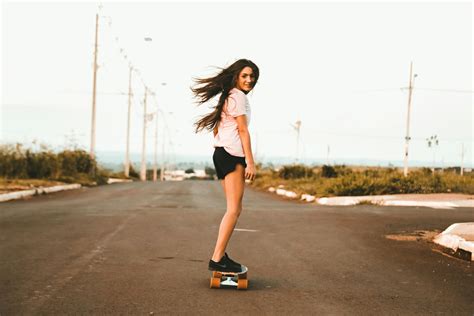 Woman Riding Skateboard At The Road · Free Stock Photo